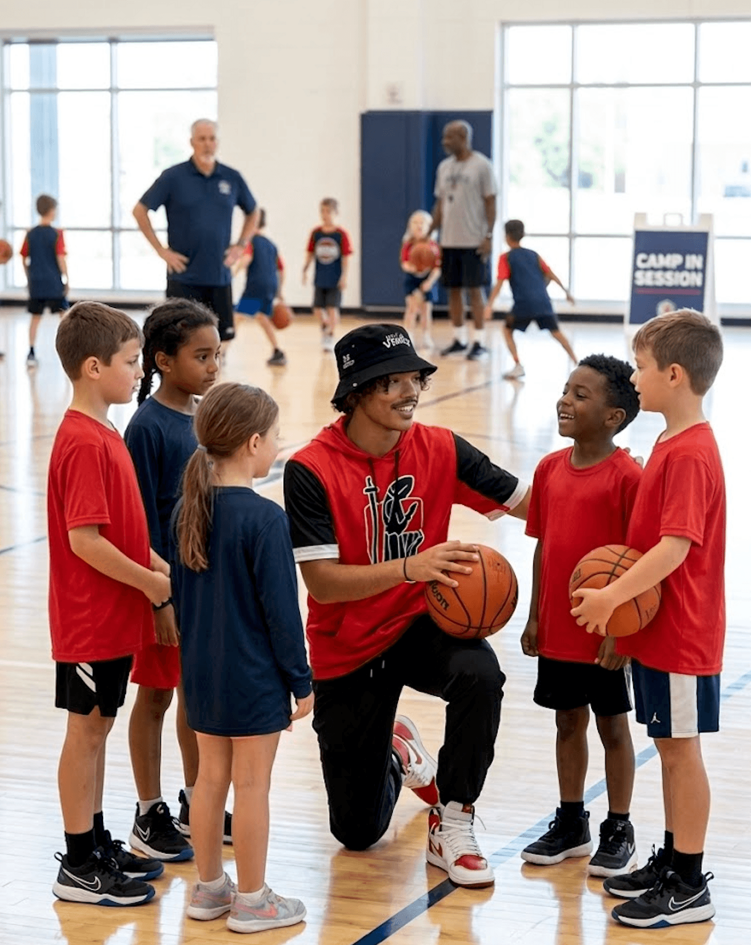 Coach Murphy with kids at basketball camp